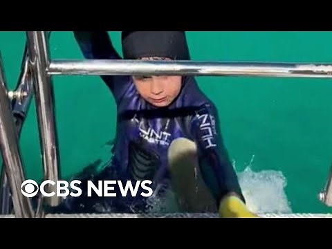 Video shows shark biting 8-year-old boy during family fishing trip