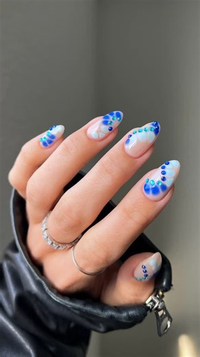 3.2K views · 644 reactions | Blues + Gems + Blooming Gel all summer long 曆 Nails by @nailsbysmf using: DND 867 Perfect Nude DC 2534 Barefoot Sea DND 734 Berry Blue DND 01 Blooming Gel DND 600 Topcoat No Cleanse Over The Rainbow Diamond Decoration DND 01 ——— #bluenails #bloominggelnails #summernails #dndgel #dndgelpolish #nailtrends #funnails #minimalnailart #naturalnails #almondnails #naildesigns | Dnd Gel | Facebook