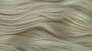 Super slow motion of wavy blonde hair in detail. Filmed on high speed cinema camera, 1000 fps.