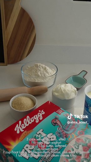 INGREDIENTS 3 cups self-raising flour, sifted 1½ cups plain yoghurt ½ cup (115g) butter, softened I cup brown sugar 1 cup Kellogg's® Kids Bubblegum-Berry Froot Loops, plus extra to garnish 1 tub (400g) store-bought cream cheese Icing #ad #6ingredientfrootloopsbuns #Kelloggs #NewLookGreatTaste #25%lesssugar #frootloops