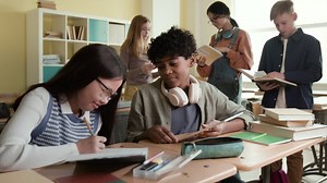 Diverse group of students studying and collaborating in a classroom | Free Stock Video Footage