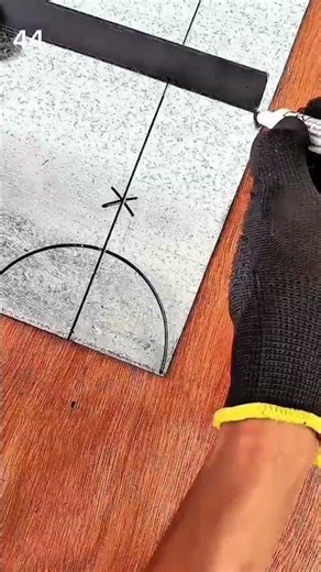 Marking a precise curved cutting line on a metal sheet using a ruler and drawn guide