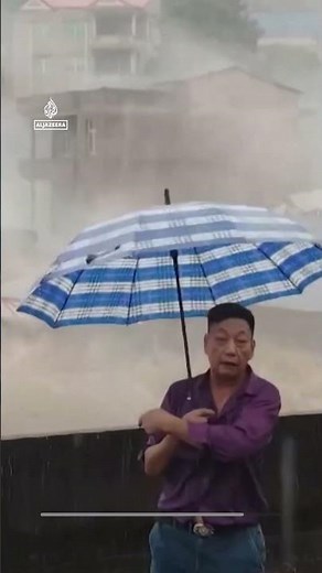 Moment three-storey building collapses amid flooding in China | AJ #shorts
