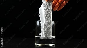 Dissolve Styrofoam into acetone for recycling. Shot on a black background