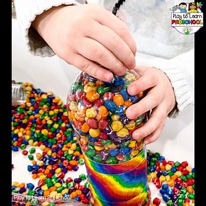Are your kids full of energy this time of year?! Give them some "heavy work" in the sensory table. The weight of these bottles combined with the mesmerizing way that they pour out will help them calm down and stay focused. More info here: https://playtolearnpreschool.us/chickpea-sensory-play/ | Play to Learn Preschool