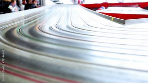 very fast small toy cars riding on huge track with extreme speed Stock Video