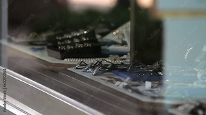 watches in a display window, model walking by