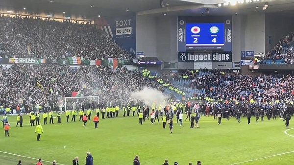 Watch: Fans clash on pitch after Celtic knock Rangers out of cup on penalties