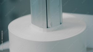 Paper converting machine at a paper manufacturing plant. Commercial mass production at automatic conveyor belt of factory line. Close up, depth of field, 4K, RED camera