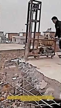 This is the Process of Demolishing Concrete Structures with an Automatic Heavy Hammer
