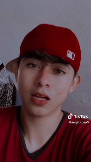 Casual Indoor Style: Red Baseball Cap and Shirt Look