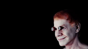 Danny Elfman Puts on a Fake Smile in Haunting “Happy” Music Video