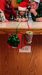 Pull the String, get a Gift -- Family Game 🎁 Kids, Dad, and family play Christmas gift party game with strings and small presents. Fun holiday game for family gatherings. This video was produced by Benson Crew, Network Media, and Benson Bros. (for entertainment purposes only) #partygames #familygathering #christmasparty #Christmas | Paul & Kezzy