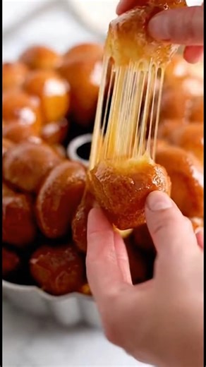 Monkey Bread Ingredients Serves 8 1 stick Unsalted Butter 2 Cans Refrigerated Biscuit Dough (each cut in fourths) 1/2 cup Packed Brown Sugar 1 teaspoon Ground Cinnamon 1/2 cup Granulated Sugar #MonkeyBread #CinnamonSugar #EasyBaking #DessertBread #FreshBaked #FoodReels #TrendingReels #SweetTreats #BrunchIdeas #ViralFood | Recipe Tips 2.0