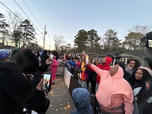 ‘It still hurts’: Family, friends hold candlelight vigil for USPS worker killed in Decatur