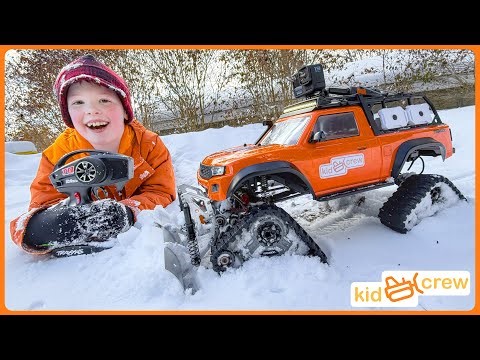 Remote controlled truck saves dad and plows snow with crawler tracks. Educational | Kid Crew