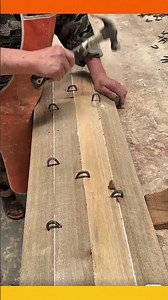 Joining boards in a circular pattern using double-headed nails. #Woodworking #Craftsmanship