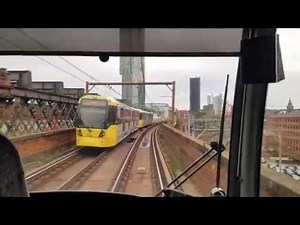 Manchester tram metrolink - driving in the city through the main station