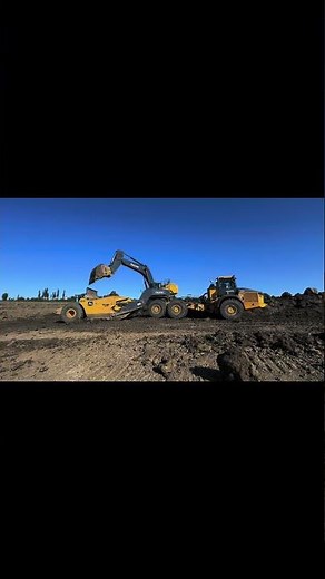 Top loading a rock truck scraper!