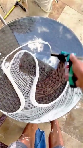 Cleaning Round Glass Tables Manually Using Squeegees for Professional Furniture Services