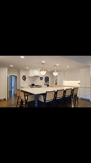 ✨ **KITCHEN TRANSFORMATION COMPLETE** ✨ We're absolutely thrilled to share this stunning kitchen remodel that perfectly blends timeless elegance with modern functionality! 🏡 This gorgeous space features: 🤍 **Crisp white cabinetry** that extends to the ceiling, maximizing storage while creating an airy, sophisticated feel ⚫ **Bold charcoal island** with a farmhouse sink, butcher block accent, and seating for six - the true heart of this home 💡 **Elegant brass pendant lighting** that adds warmt