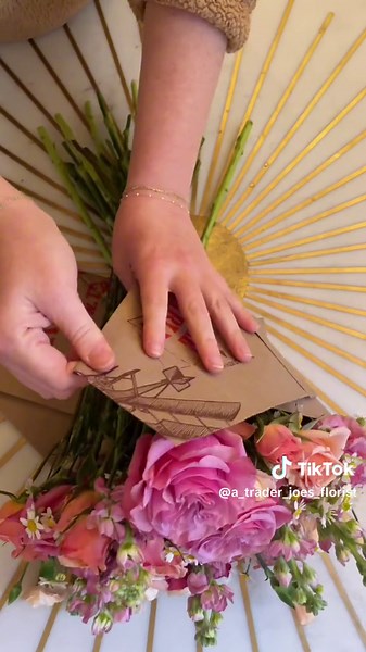 Replying to @Alexis Garcia seemed like a good time to update this one! (I've gotten much faster at cutting the bag ) happy arranging!! #diybouquet #bouqetwrap #affordableflowerbouquet #bouqetgift #traderjoesflowers