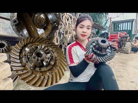 The female mechanic: Repairing and maintaining tractors, cleaning engines.