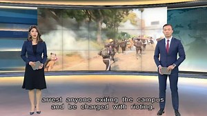 Protesters inside the heavily-fortified Polytechnic University made three escape attempts today in a bid to evade capture by police, who have said they would arrest anyone exiting the campus and be charged with rioting. All their escape attempts failed however, with officers pushing them back inside the school using non-lethal weapons. | HOY International Business Channel