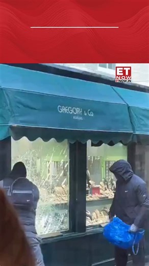 CCTV footage has captured a brazen daylight robbery at Garrard & Co jewellers in Richmond, London, on January 31, 2026. The video shows masked men using hammers to smash the store’s window display before fleeing with stolen jewellery within seconds. [London, Richmond, Garrard & Co, daylight robbery] #ETTrendingNow | ET NOW