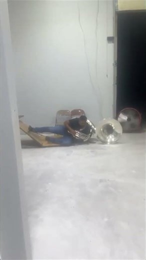 Sousaphone Player Plows Through Folding Table Mid-Song