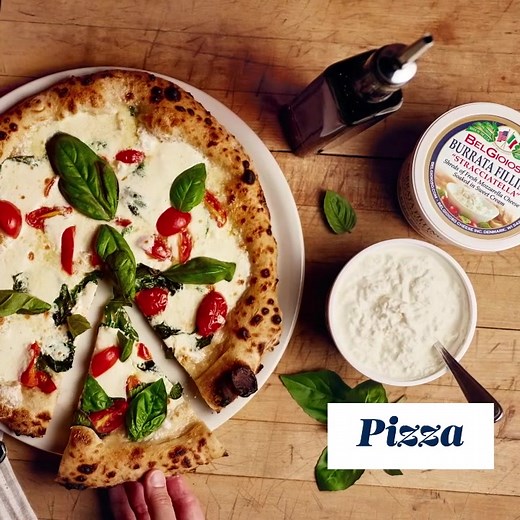 Savor the creamy goodness of BelGioioso Burrata Filling! Made with shreds of fresh mozzarella soaked in sweet cream, it’s perfect for topping pizzas, pastas, salads, or as a delicious appetizer with bread and tomatoes. | BelGioioso Cheese
