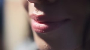 Young woman with good makeup smiling close-up