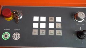 Laser cutting machine keys, keypad. Automatic use. The view of the keys to be used on the CNC laser cutting machine. The device is working and some keys are flashing.