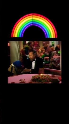 Sam and friends sitting next to Jim Henson