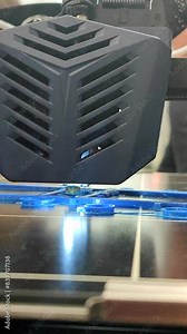 Process of printing object on 3D printer from molten plastic. 3D printer printing model using plastic from extruder. 3D printing technology. New modern additive prototyping technologies. Vertical