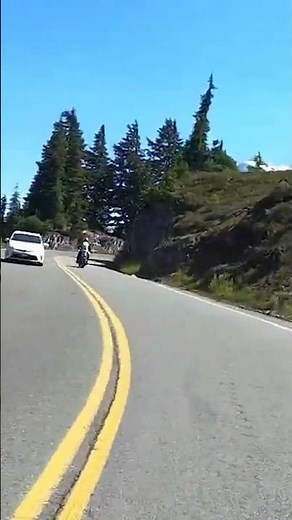 Riding through mountains on a Janus Halcyon 450 motorcycle