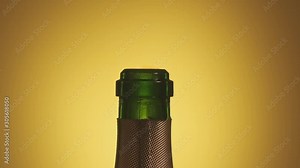 Opening bottle of champagne wine. Close-up of champagne explosion with flying cork. Champagne explosion. Party concept in slow motion