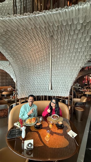 Krishni - Dubai based influencer on Instagram: "We started our day with a refined breakfast — gentle flavors, a beautiful setting, and the Dubai Mall Fountain right in front of us 🤍 From a refreshing welcome drink to perfectly brewed cappuccino and latte, everything set the tone for a calm morning. The breakfast spread was beautiful — we chose the blossom berry oats, light and fresh, and the salmon delight croissant, which was absolutely delicious. The outdoor ambiance is so peaceful, with stun