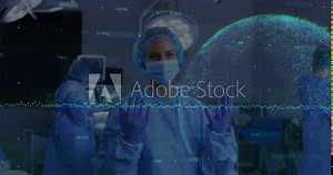 Female surgeon in surgery room reacting to green waveform watching holographic globe expanding