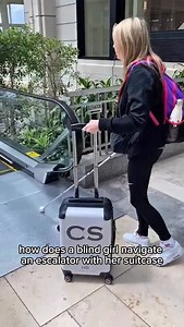 Because why wouldn’t a blind girl attempt to go down an escalator with a suitcase? Honestly, what could possibly go wrong? hashtags: #BlindnessAwarenessMonth #AccessibleTravel #AccessibilityMatters #DisabilityAwareness #LifeWithSightLoss Video description Claire walks towards an escalator, holding a small cabin-sized suitcase in her left hand and her white cane, Rick the Stick, in her right. She feels for the ridges with Rick, lines herself up, and steps on like a pro. When she reaches the end, 