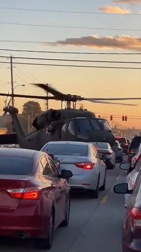 Drivers on Perkins Road were forced to scatter when a medical helicopter made an emergency landing in the middle of live traffic, dropping so low that dust clouds and debris blasted across windshields. The clip shows cars braking hard as the helicopter hovers inches above the asphalt, its tail drifting dangerously close to utility poles while stunned drivers jump out and run for cover. Incredibly, the pilot manages to plant the aircraft right between two lanes, the rotor wash shaking nearby stre