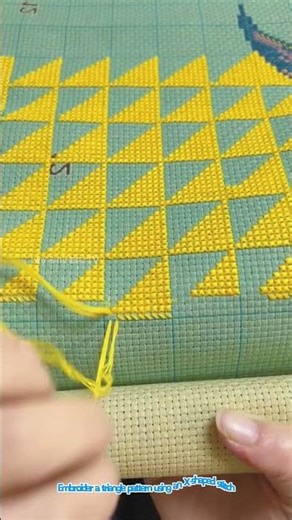 Embroider a triangle pattern using an X shaped stitch