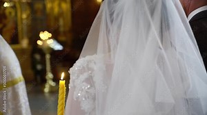 The wedding in the Church. Marriage ceremony in a Christian Church. The priest, the bride and groom inside Stock Video