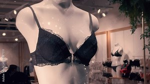Black bra worn on a woman's mannequin in a lingerie store window Stock Video