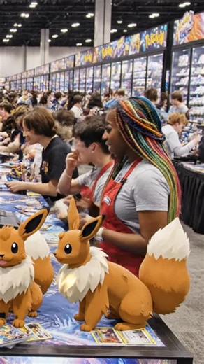 Why are all pokemon card conventions exactly the same 🎪🃏 Why Every Pokémon Card Convention Feels Like You’ve Already Been There Before… Again 😮‍💨🔥 You walk in, and before your eyes even adjust to the fluorescent lighting, you already know how the day will go. The smell hits first—plastic sleeves, cardboard, energy drinks, and desperation. Rows of identical white tables stretch endlessly, each one covered in the same ETBs, the same slabs, the same “RARE 🔥 INVESTMENT 🚀” signs written in Sha