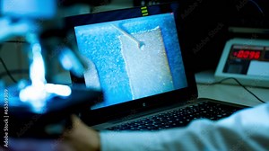 check micro electronic chip under a microscope