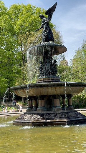 Bethesda Fountain's majestic angel sculpture rises above the waters, a symbol of peace and tranquility in the heart of Central Park. Surrounded by nature's beauty, this iconic landmark is a breathtaking sight to behold. #discovernewyork | Discover New York