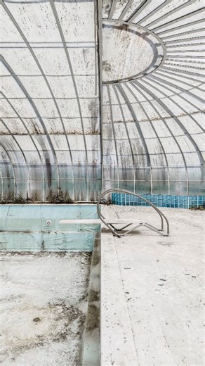 Bleached A forgotten indoor pool somewhere in Portugal — drained, sun-bleached, and sealed beneath a glass dome that once opened along a rail system to let the light in. When I arrived, it was barely open — just a narrow gap, enough to let in a shimmer of air. I had been looking for this place for a very long time, and in the end, I only found it through a friend’s tip. The excitement was huge — but so was the heat. Inside it must have been around 45 °C, maybe more. The air stood still, thick an