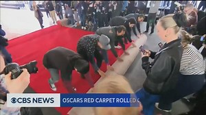 57K views · 375 reactions | Hollywood rolled out a pricey new red carpet for the Oscars on Saturday, after the surprise of last year's champagne-colored rug. | CBS Evening News | Facebook