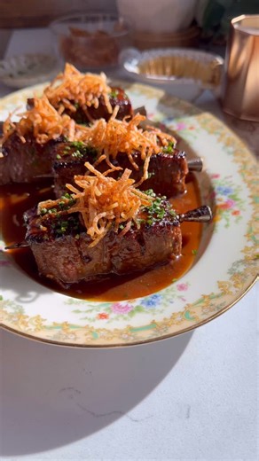 Misoyaki Steak Frites Skewers for my “Just A Plate” series ep.4! I made them for this dinner party and they were a hit! Flaky and perfectly caramelized with the crispy potatoes 😍. Ingredients: * 4 lb ribeye * 1/3 cup mirin * 1/3 cup sake * 1/2 cup red miso * 1/2 cup sugar * 2 russet potatoes (peeled and cut into shoestring shape). * Chives to taste * 3/4 cup beef bone broth or Demi * 2 tbsp butter * 1 tbsp rice vinegar * Black pepper to taste Directions: 1. Add the sake and mirin to a saucepan 